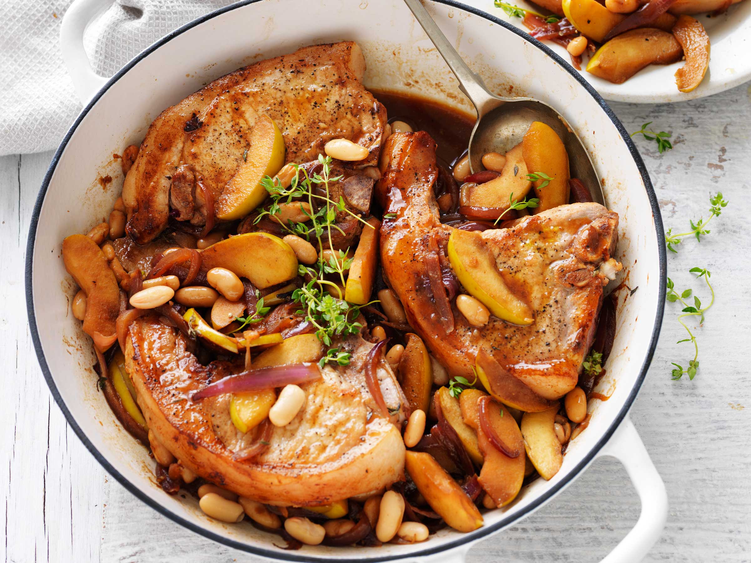 Pan-roasted pork chops with apple & beans | Australian Pork