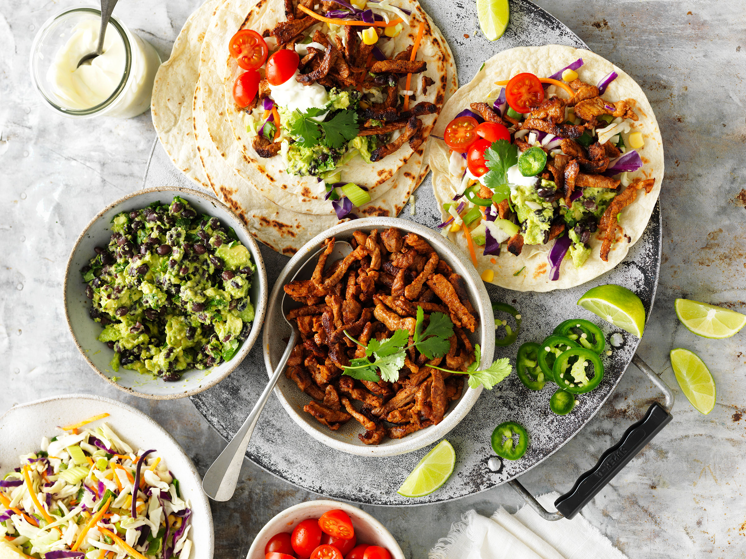 Spicy pork, avocado and black bean smash tacos | Australian Pork